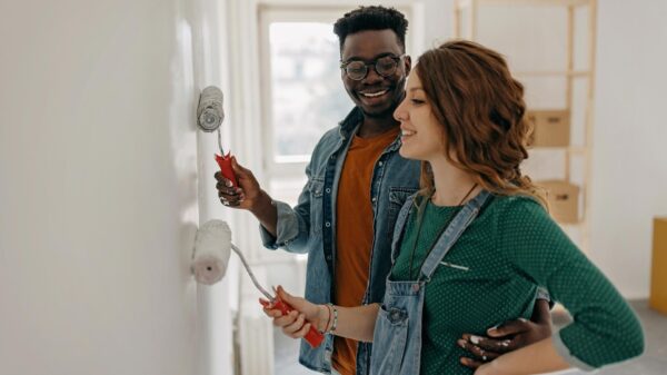 Young couple painting walls