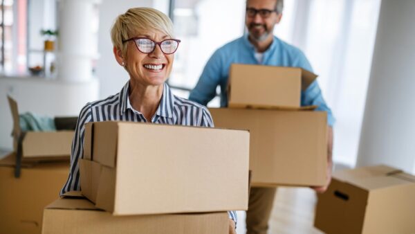 Happy couple moves into new home