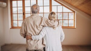 Happy senior couple in their empty new house