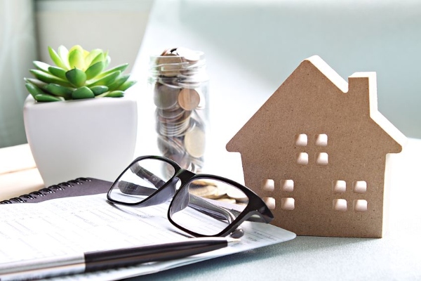 paperwork-glasses-and-jar-of-money